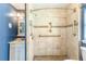 This bathroom features a tiled shower with grab bars and updated vanity at 3556 Riley Rd, Douglasville, GA 30134