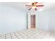 Light blue bedroom with tiled floor and ceiling fan at 3556 Riley Rd, Douglasville, GA 30134