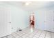 Light blue bedroom with tile floor at 3556 Riley Rd, Douglasville, GA 30134