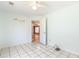 Light blue bedroom with tile floor and light fixture at 3556 Riley Rd, Douglasville, GA 30134