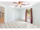 Bedroom with tile floors, and a window with curtains at 3556 Riley Rd, Douglasville, GA 30134