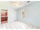 Bedroom with tile floors and view to bathroom at 3556 Riley Rd, Douglasville, GA 30134