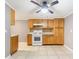 Bright kitchen features tiled floors, a mosaic backsplash, and ample wooden cabinets at 3556 Riley Rd, Douglasville, GA 30134