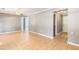 Open living area with tile floors and neutral paint, leading to bedrooms at 3556 Riley Rd, Douglasville, GA 30134