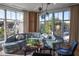 Bright living room with a corner fireplace and large windows with natural light at 675 Drewry Ne St # 303, Atlanta, GA 30306