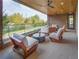 Inviting patio with comfortable seating, wood ceiling, and glass railing offering views of the cityscape at 675 Drewry Ne St # 303, Atlanta, GA 30306