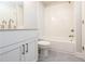 Bathroom with a combination tub and shower, grey tile floor, and white vanity at 134 Wards Crossing Way # 17, Johns Creek, GA 30022