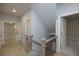 Hallway featuring wood flooring, recessed lighting, modern railing design and a view to a sunlit room at 134 Wards Crossing Way # 17, Johns Creek, GA 30022