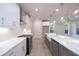 Kitchen featuring white cabinets, a kitchen island with a sink, and stainless steel appliances at 134 Wards Crossing Way # 17, Johns Creek, GA 30022
