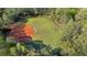 Aerial view of private baseball and soccer field surrounded by trees at 169 Twickenham Trce, Suwanee, GA 30024