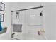 Clean white tile shower with glass doors at 169 Twickenham Trce, Suwanee, GA 30024