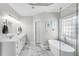 Elegant bathroom with double vanity, soaking tub, and a separate glass enclosed shower at 169 Twickenham Trce, Suwanee, GA 30024