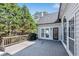 Spacious back deck with views of tall, mature trees and greenery at 169 Twickenham Trce, Suwanee, GA 30024