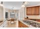 Modern kitchen adjacent to a breakfast nook with hardwood floors and great lighting at 169 Twickenham Trce, Suwanee, GA 30024