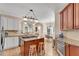 Gourmet kitchen with a center island, stainless appliances, and open layout at 169 Twickenham Trce, Suwanee, GA 30024