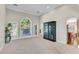 Spacious living room with a view of the backyard, natural light, and easy access to the kitchen at 169 Twickenham Trce, Suwanee, GA 30024