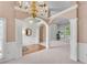 Open living space with decorative trim, natural light and arched doorways at 169 Twickenham Trce, Suwanee, GA 30024