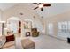 Open-concept living room with views of the kitchen and dining area at 169 Twickenham Trce, Suwanee, GA 30024