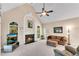 Inviting living room featuring a fireplace and ample natural light at 169 Twickenham Trce, Suwanee, GA 30024