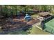 Aerial view of the community playground with slides, swings, and a covered picnic area at 169 Twickenham Trce, Suwanee, GA 30024