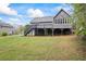 Beautiful backyard with a spacious deck and patio perfect for entertaining or relaxing outdoors at 65 Indian Springs Ne Dr, Rydal, GA 30171