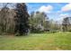 Overiew of the backyard with shed amongst the trees, ready for your enjoyment and relaxation at 65 Indian Springs Ne Dr, Rydal, GA 30171