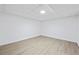 A bright, finished basement with light wood-look flooring and ready for personalization to your needs at 65 Indian Springs Ne Dr, Rydal, GA 30171