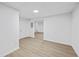 Bright, finished basement featuring light wood-look floors and neutral paint ready for your personalization at 65 Indian Springs Ne Dr, Rydal, GA 30171