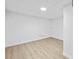 Spacious basement featuring wood-look floors and neutral walls at 65 Indian Springs Ne Dr, Rydal, GA 30171