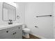 Bathroom featuring a vanity with a single sink, modern fixtures, and neutral walls at 65 Indian Springs Ne Dr, Rydal, GA 30171