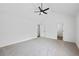 Bright bedroom featuring a vaulted ceiling with fan, neutral walls, and carpet at 65 Indian Springs Ne Dr, Rydal, GA 30171