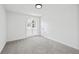 Bright bedroom featuring neutral carpet, large window, and ample closet space at 65 Indian Springs Ne Dr, Rydal, GA 30171