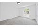 Bedroom featuring carpet, window and closet at 65 Indian Springs Ne Dr, Rydal, GA 30171