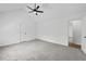 Bright bedroom featuring a vaulted ceiling with fan, neutral walls, and carpet at 65 Indian Springs Ne Dr, Rydal, GA 30171