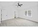 Bright bedroom featuring a vaulted ceiling with fan, neutral walls, and carpet at 65 Indian Springs Ne Dr, Rydal, GA 30171