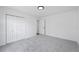 Bedroom featuring neutral carpet, closet, and access to the hallway at 65 Indian Springs Ne Dr, Rydal, GA 30171