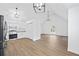 Bright living room featuring wood floors, vaulted ceilings, and updated lighting fixtures at 65 Indian Springs Ne Dr, Rydal, GA 30171