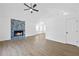Bright living room with hardwood floors, a modern fireplace, and white walls at 65 Indian Springs Ne Dr, Rydal, GA 30171