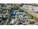 Aerial view of tennis courts and a community pool in a residential area at 9105 Old Southwick Pass, Johns Creek, GA 30022