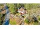 Aerial view of a large estate with mature trees and lush landscaping at 9105 Old Southwick Pass, Johns Creek, GA 30022