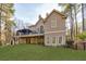 Back exterior view of a home with a large deck and expansive backyard at 9105 Old Southwick Pass, Johns Creek, GA 30022