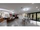 Large finished basement with bar area, lounge seating, and modern lighting at 9105 Old Southwick Pass, Johns Creek, GA 30022
