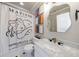 Bright bathroom featuring marble countertops, unique mirror, modern faucet, and a designer shower curtain at 9105 Old Southwick Pass, Johns Creek, GA 30022
