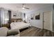 This bright main bedroom features hardwood floors, crown molding and updated fixtures at 9105 Old Southwick Pass, Johns Creek, GA 30022