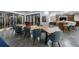 Open-concept dining room with a large table, stylish chairs, a wine cellar, and bar area at 9105 Old Southwick Pass, Johns Creek, GA 30022