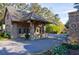 Community entrance featuring brick architecture and well maintained landscaping at 9105 Old Southwick Pass, Johns Creek, GA 30022