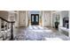 Beautiful foyer with black accent doors, marble floor and staircase at 9105 Old Southwick Pass, Johns Creek, GA 30022