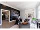 Bright home office with natural light, modern desk, gray walls, and hardwood floors at 9105 Old Southwick Pass, Johns Creek, GA 30022