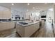 Spacious open-concept kitchen with island, modern appliances, and plenty of counter space at 9105 Old Southwick Pass, Johns Creek, GA 30022