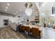 Bright open-concept kitchen featuring large island, stainless steel appliances, and modern lighting at 9105 Old Southwick Pass, Johns Creek, GA 30022